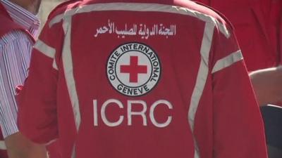 A man wearing an International Red Cross uniform