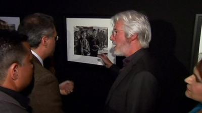 Actor and activist Richard Gere in front of one of his pictures at the exhibition