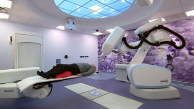 Someone being treated with CyberKnife