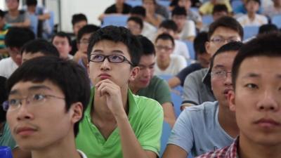 Male students sit in class at the China Mining and Technology University in China’s eastern Jiangsu province