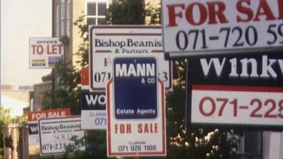 For sale signs on houses