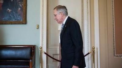 Senate Majority Leader Harry Reid arrives at his office at the US Capitol on October 16, 2013 in Washington, DC