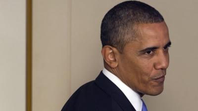 US President Barack Obama turns around to answer a question at the White House on 16 October 2013