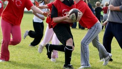 children playing rugby