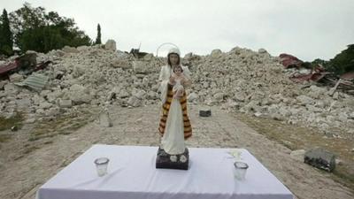 An altar in front of rubble