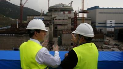 George Osborne (L) talks with Taishan Nuclear Power Joint Venture general manager Guo Liming