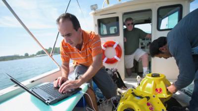 Researchers from the University of Buffalo on a boat