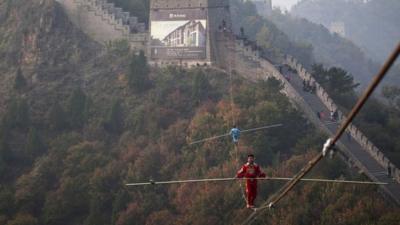 Tightrope walker above the Great Wall of China