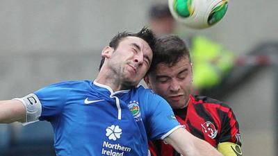 Linfield's Michael Gault in action against Crusaders Colin Coates