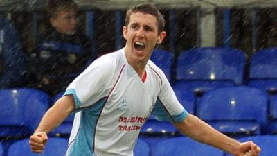 Gary Thompson celebrates scoring for Ballymena against Dungannon