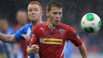 Match action from Cliftonville against Warrenpoint at Solitude