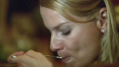 Woman eating in NYC restaurant