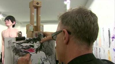 Person drawing an exhibit from the 2013 Turner Prize exhibition