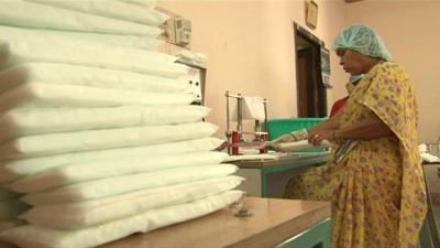 Woman making low-cost sanitary towels