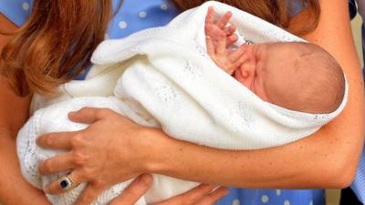 Prince George in his mother's arms