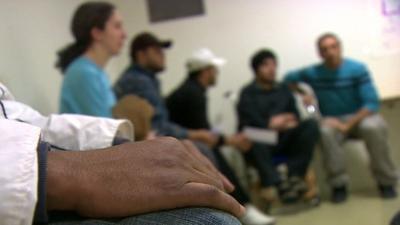 Syrian refugees at a migrant processing centre in Sweden