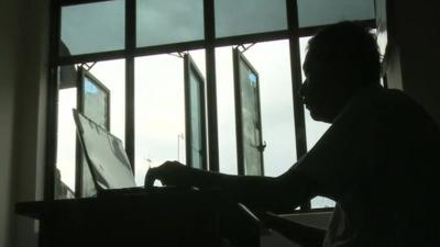 Man looking at computer screen