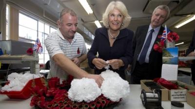 The Duchess of Cornwall working on a wreath