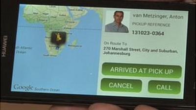 The app shows that the taxi has arrived at the pick up address