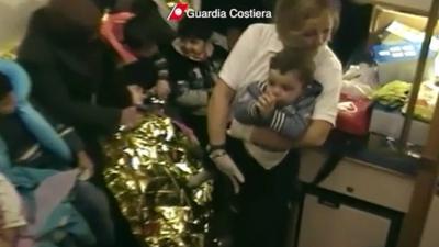 A toddler on board a coast guard boat