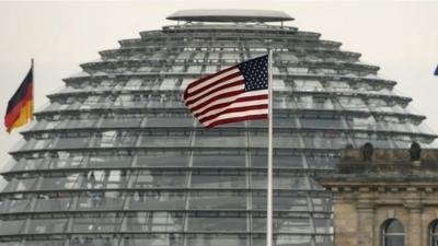 US flag flying over embassy next to German Parliament