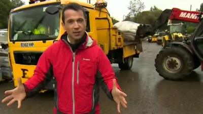 Hywel Griffith at a council depot where sandbags are being loaded onto lorries