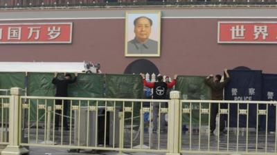 Barriers are set up in Tiananmen Square after the crash