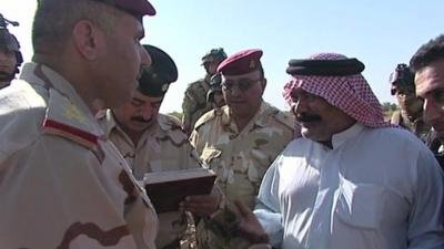 Army General speaking to tribe leader