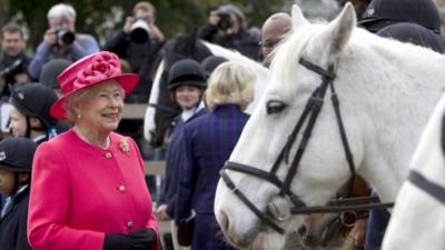 Queen Elizabeth II and Camilla, Duchess of Cornwall during a visit to Ebony Horse Club Community Riding Centre