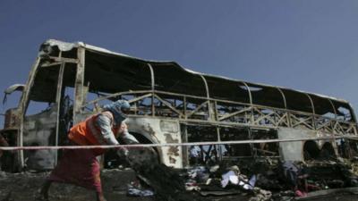 Debris is cleared from the bus crash