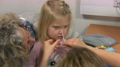 A child receiving the flu vaccine