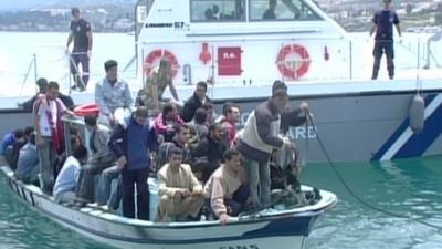 Migrants in a boat off the shore of lesvos