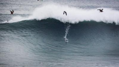 Andrew Cotton surfing