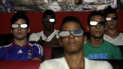 People watch a 3D movie