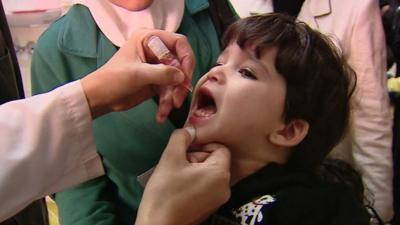 Syrian child receiving Polio vaccination