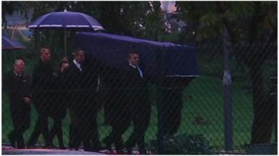 the coffins of the two French journalists killed in Mali