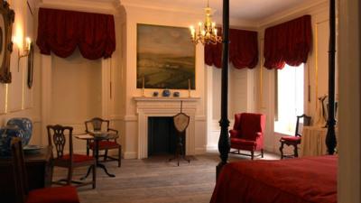 A grand bedroom, following restoration.