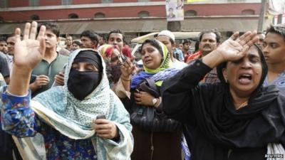 Relatives of soldiers react to the court's ruling in Dhaka