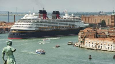 Cruise liner dwarfing Venice's buildings