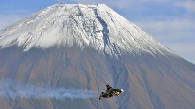 Jetman flying past Mount Fuji