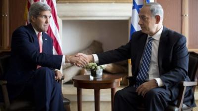 U.S. Secretary of State John Kerry (L) shakes hands with Israel's Prime Minister Benjamin Netanyahu in Jerusalem