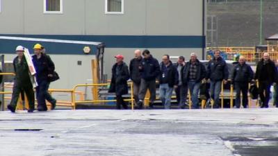 Workers leaving a Clydeside shipyard