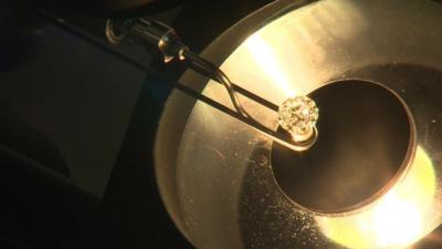 A diamond being examined