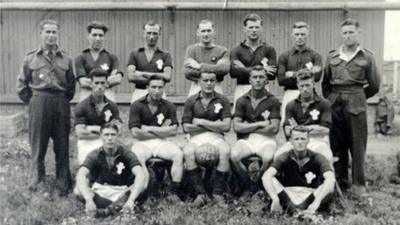 Wales football team at Auschwitz - Mr Jones is in the middle of the back row