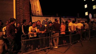 Revellers queue for the Ministry of Sound