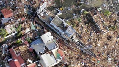 An aerial view of devastation and a ship after it was swept at the height of super typhoon Haiyan in Tacloban city in central Philippines