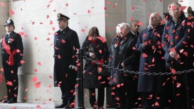 Poppies fall during ceremony at the Menin Gate