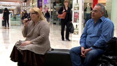 Katherine Devlin smoking an e-cigarette in a shopping centre