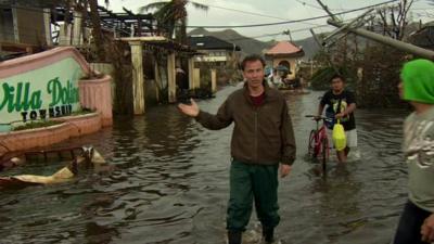 BBC correspondent Rupert Wingfield-Hayes in flooded Tacloban