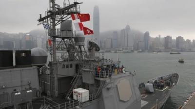 U.S. sailors of the USS Antietam (CG-54) from the George Washington Battle Group stand on the deck before sailing to the Philippines at Hong Kong Victoria Harbor Tuesday, Nov. 12, 2013